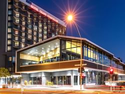 Exterior view of Hotel Grand Chancellor Brisbane captured at night