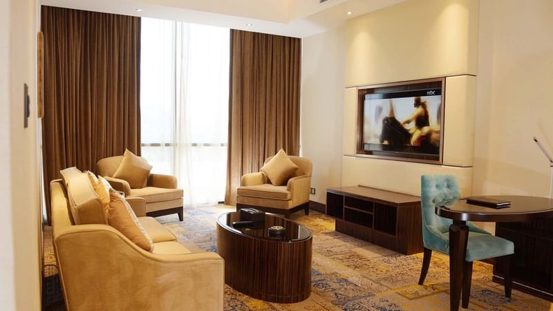 Living room with couches & carpeted floors in Business Suite at Warwick Al Khobar