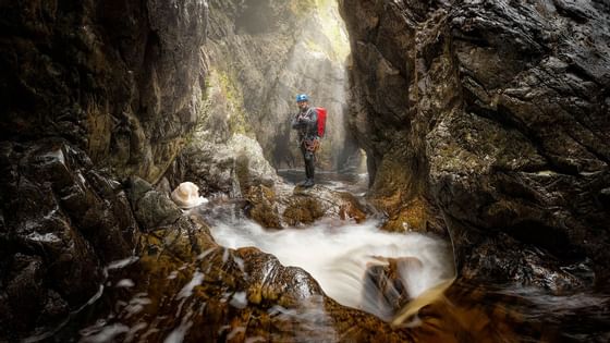 Man by a canyon in Cradle mountains near Cradle Mountain hotel