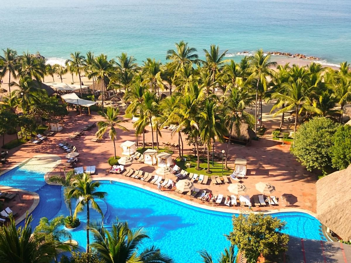 Aerial view of the hotel, pool & beach at La Colección Resorts