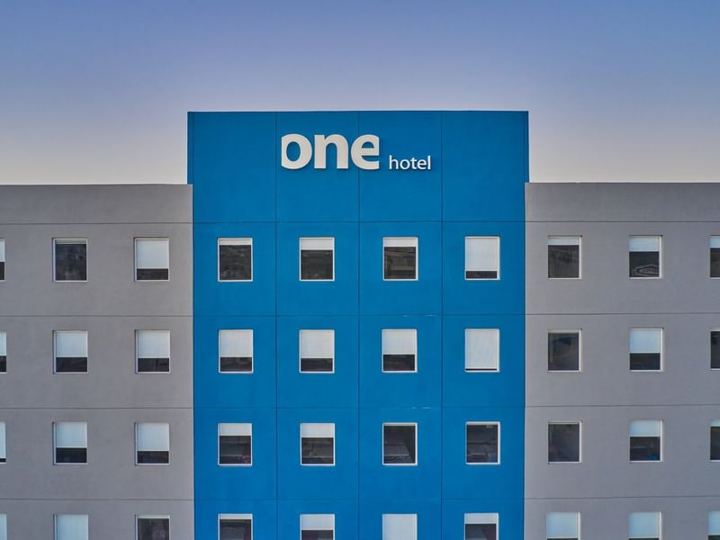 Exterior view of the hotel building & sign at One Hotels