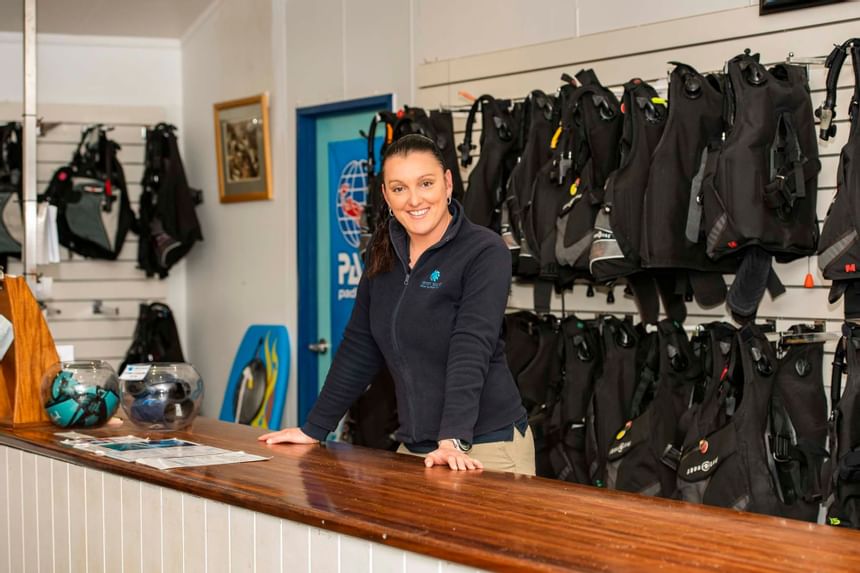 Lady at Diving Gear Shop counter at Heron Island Resort