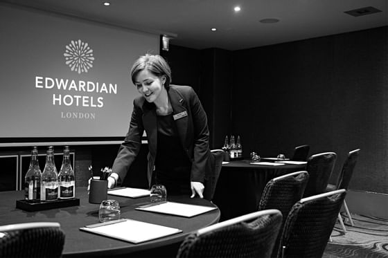 Staff preparing meeting room, Edwardian Hotels Group
