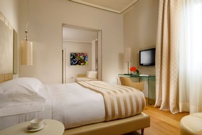 Comfortable bedroom at Grand Hotel Minerva