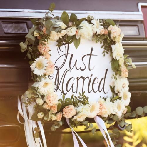 Just married sign on car, representing the barmet al-aroos Arab wedding tradition