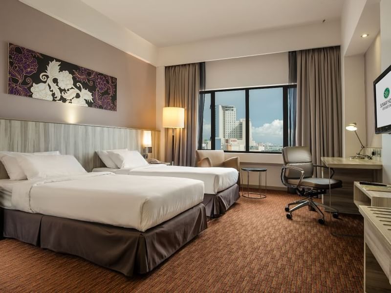 Image 118: Two comfy bed and working table in Premier Park View Twin Room at Sunway Hotels & Resorts