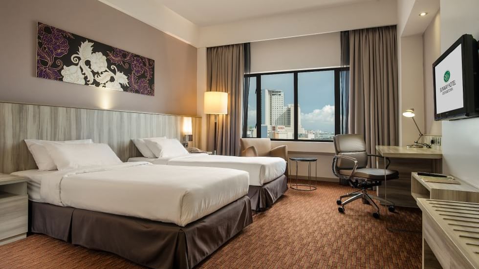 Two comfy bed and working table in Premier Park View Twin Room at Sunway Hotels & Resorts