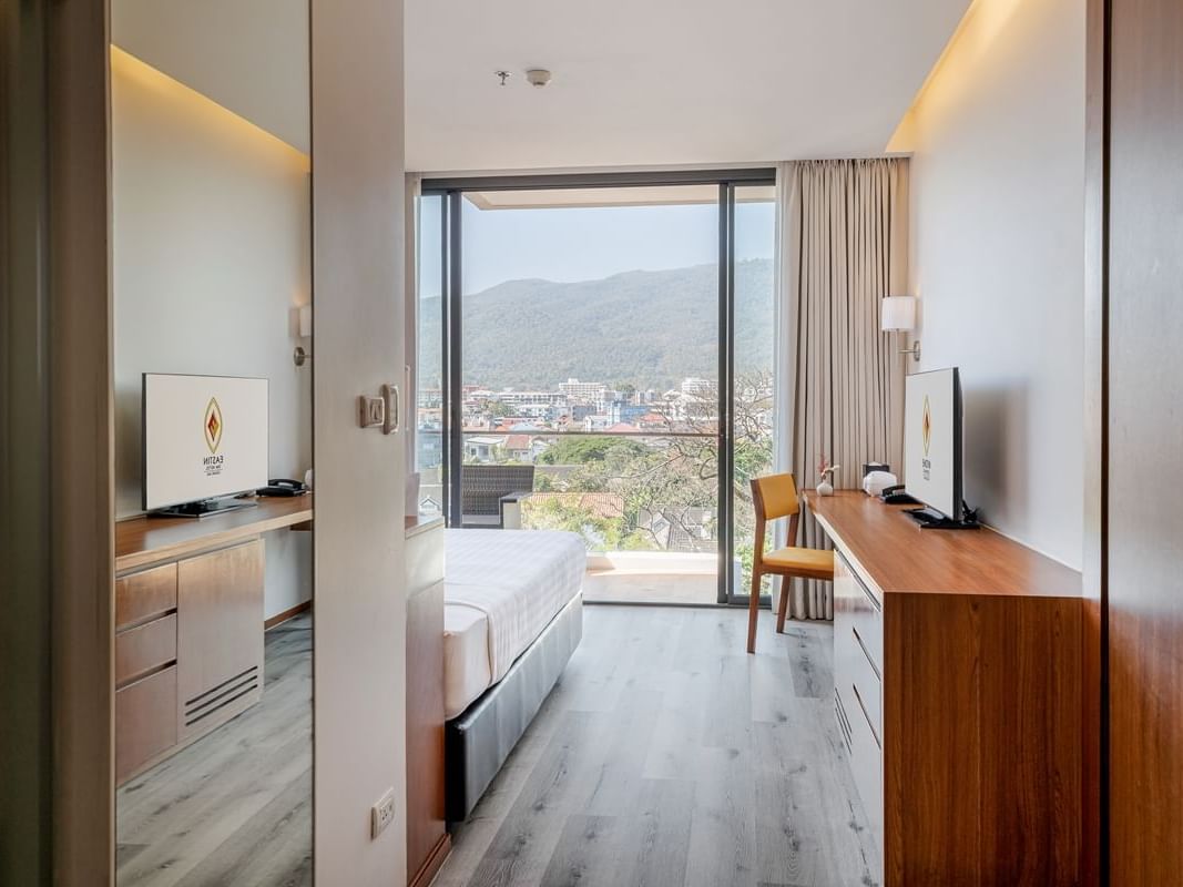 Tv, Mirror & working area of Superior Premium Mountain View with Bathtub room at Eastin Tan Hotel Chiang Mai