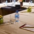 Water, notepads on meeting table at The Royal Riviera Hotel