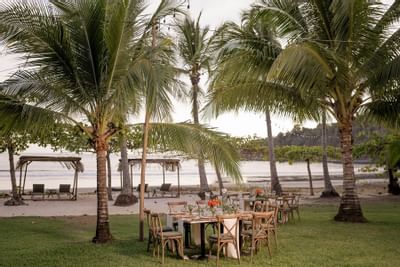 A dining & lounge area with a beach view at Punta Islita Hotel