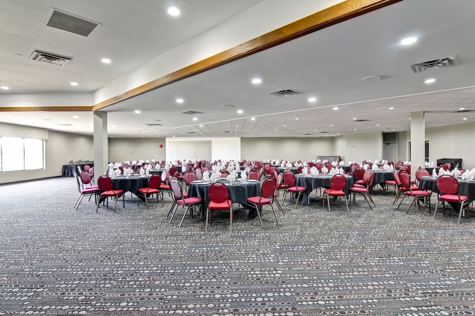 Tables set up for event in ballroom