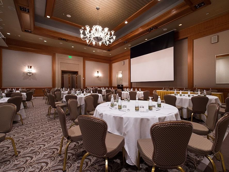 Banquet-style business event room set up in the Ballroom at Umstead Hotel and Spa