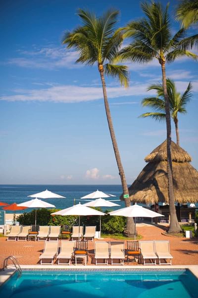 Square pool with ocean view at Buenaventura Grand Hotel