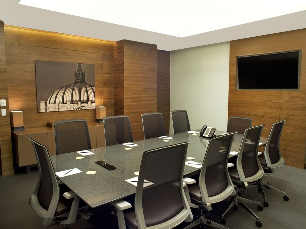 The Adriatic meeting room with office chairs & TV at Live Aqua Urban Resort México