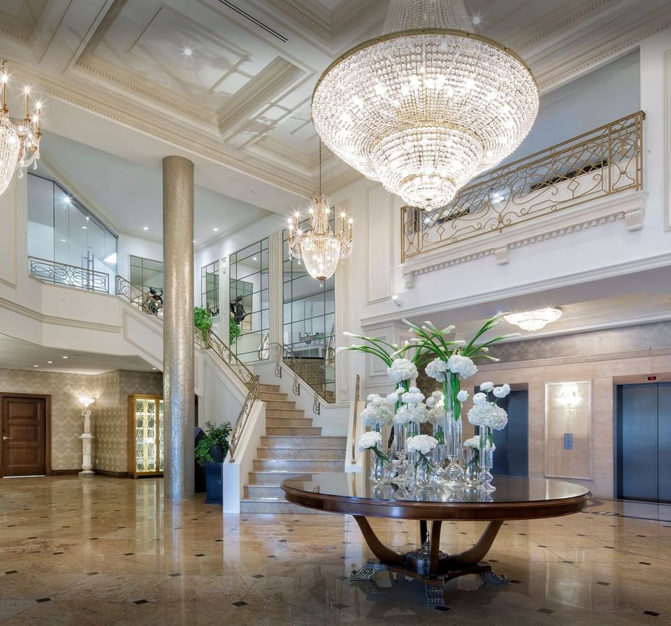 Interior of lobby area with stairway at Chateau Vaudreuil