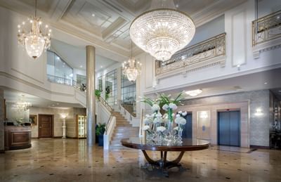 Interior of lobby area with stairway at Chateau Vaudreuil