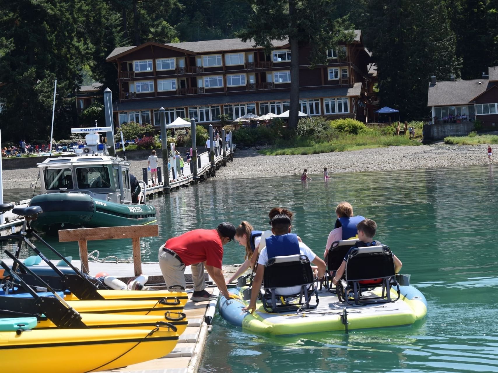Family enjoying a boat ride on the lake near Alderbrook Resort & Spa