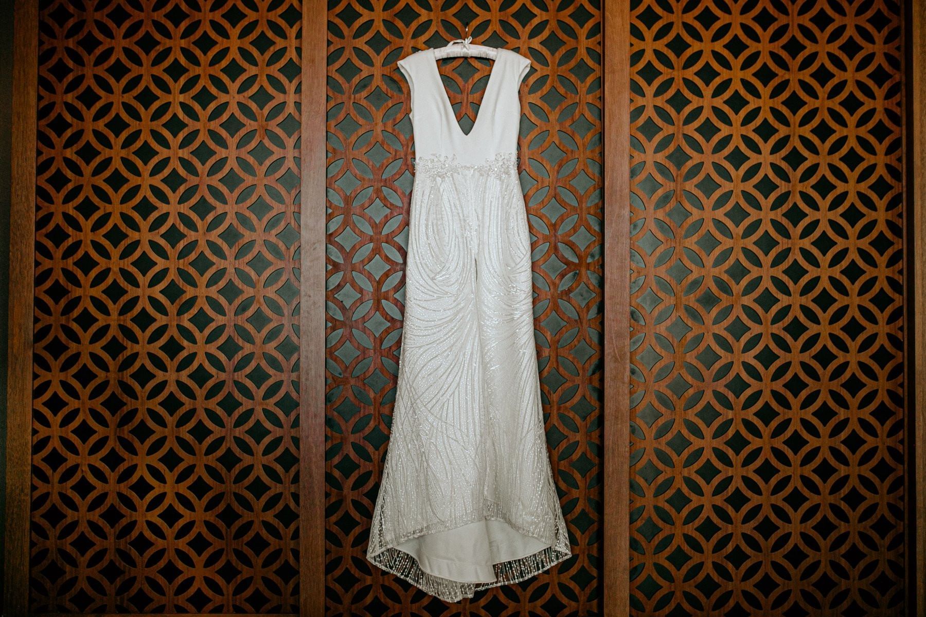 A bridal dress hung on a wall at Live Aqua Resorts