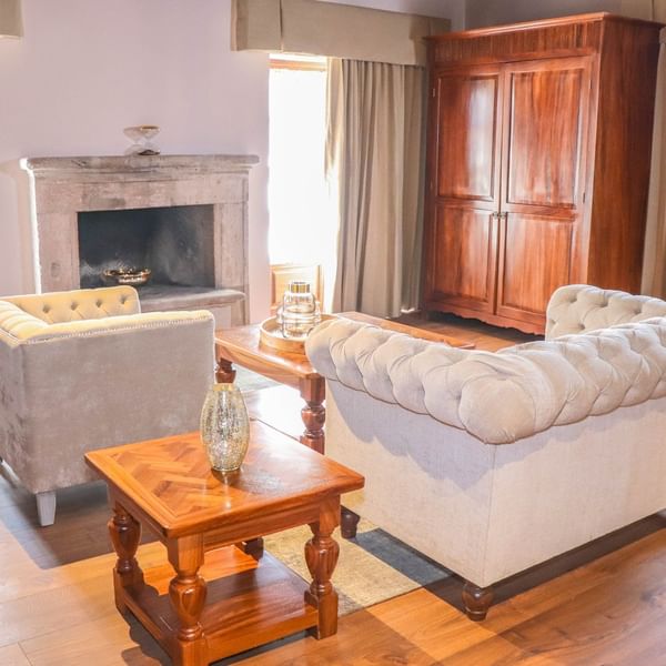 Living area with fire place of Junior Suite at Gamma Hotels