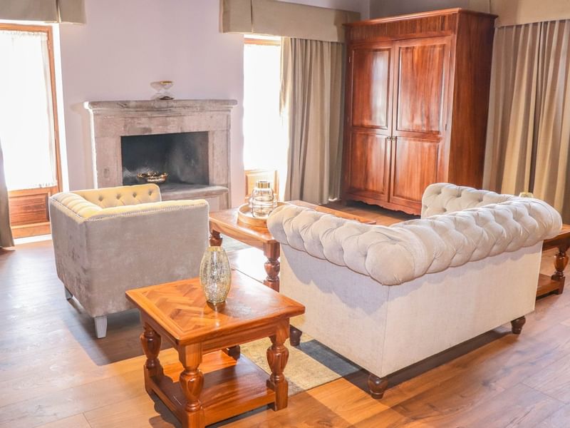 Living area with fire place of Junior Suite at Gamma Hotels