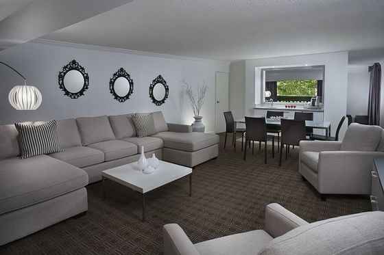 Large couches and chairs in a hotel suite