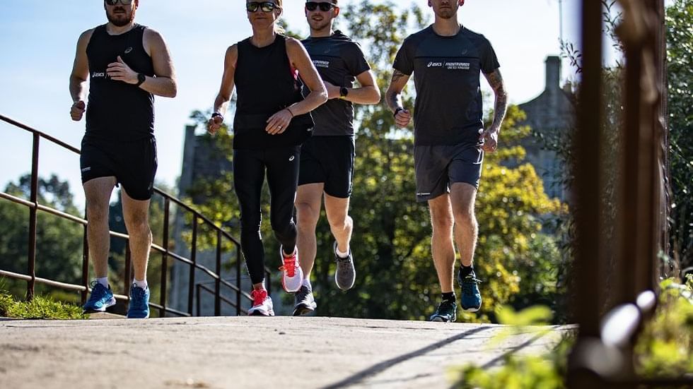 Group of four menwearing black jogging near Falkensteiner Hotel Belgrade