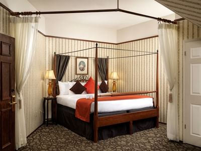 Four poster bed with a vintage decor in Victoria Room at Pendray Inn & Tea House