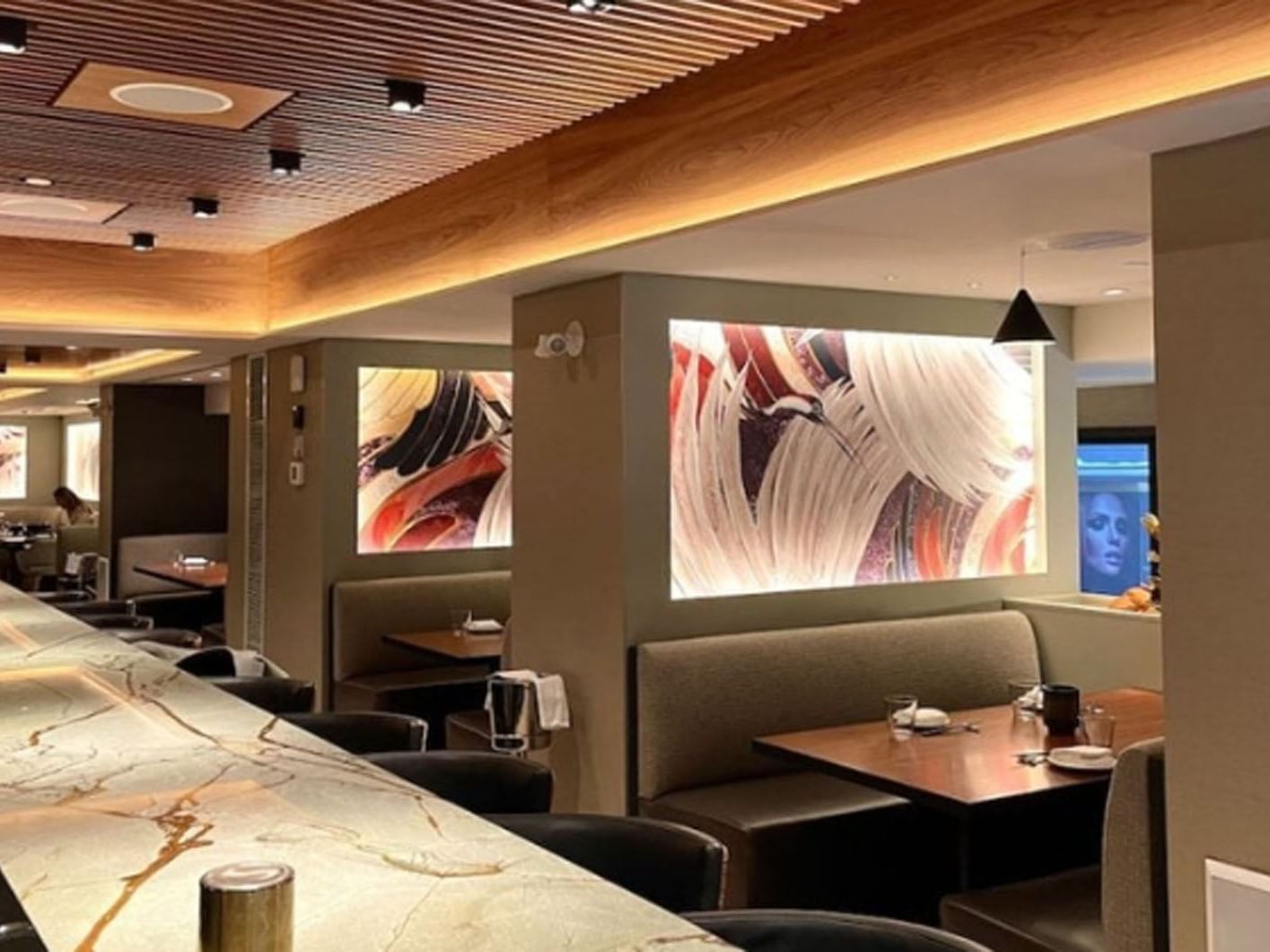 Kasa Moto with set up tables and abstract wall art near Hotel X, hotels in Toronto downtown