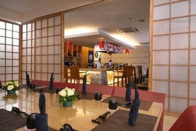 Authentic Japanese restaurant interior with chefs preparing dishes at UMI Japanese Restaurant - Grand Lexis Port Dickson