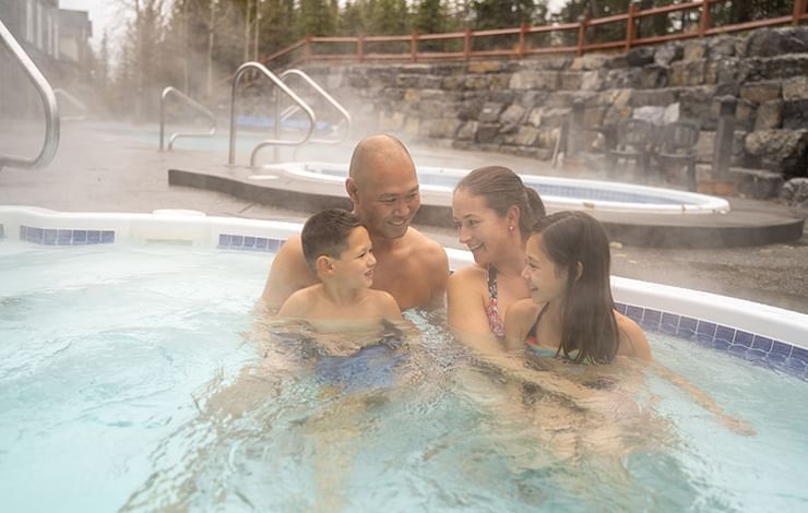 Family enjoying in a Heated Pool at Blackstone Mountain Lodge