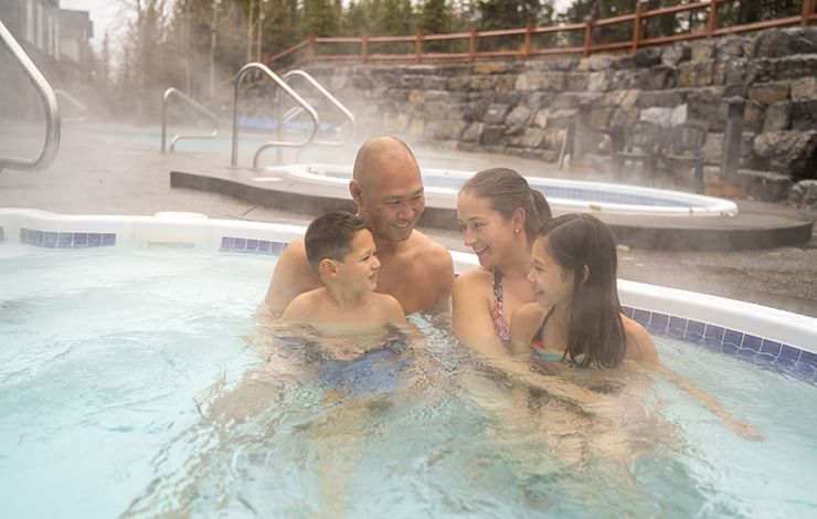 Family in a Heated Pool at Blackstone Mountain Lodge
