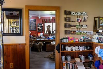 Entrance to the gift shop at The Ranch at Ucross featuring Western decor, souvenirs, and merchandise