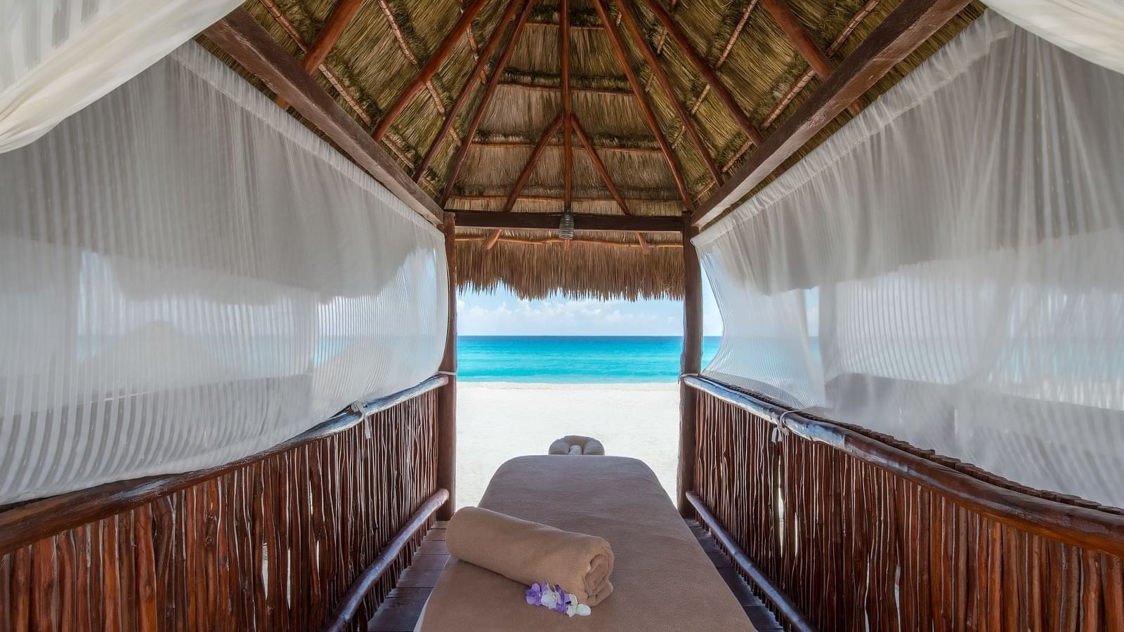 Beach hut with a spa bed at Fiesta Americana Cozumel