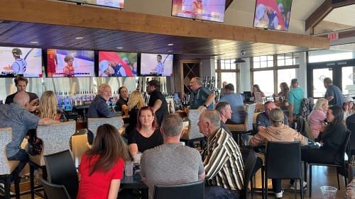 People dining & lounging in The Anchor Galley & Sports Bar near Shangri-La Monkey Island