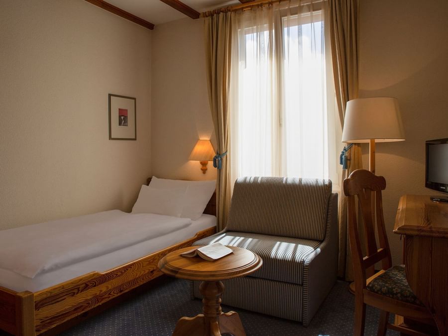 the south triple room with single bed at The Originals Hotels