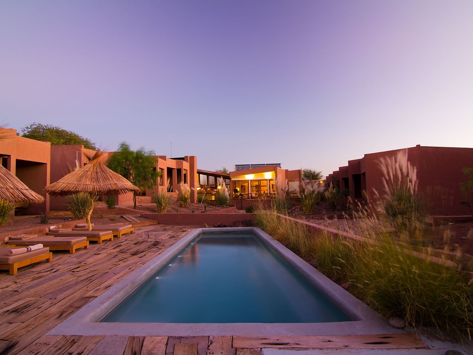 outdoor pool with lounging area at NOI Casa Atacama Hotel 