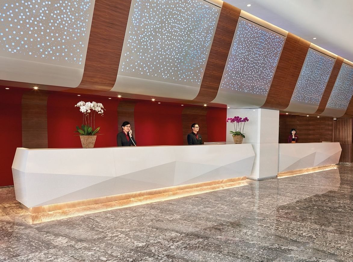 Two concierges at the reception at Sunway Hotel Pyramid