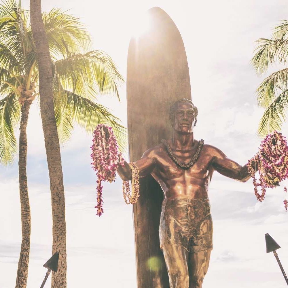 Low angle view of Duke Paoa Kahanamoku Statue near Waikiki Resort Hotel by Sono