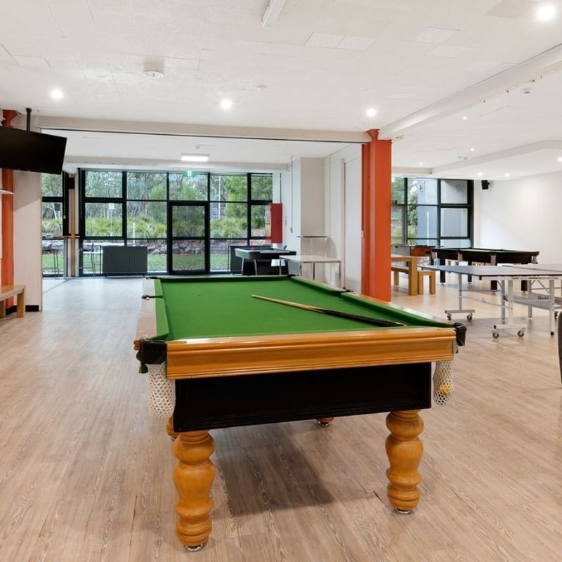 Spacious game room with pool and ping pong tables at La Trobe University – Menzies College.