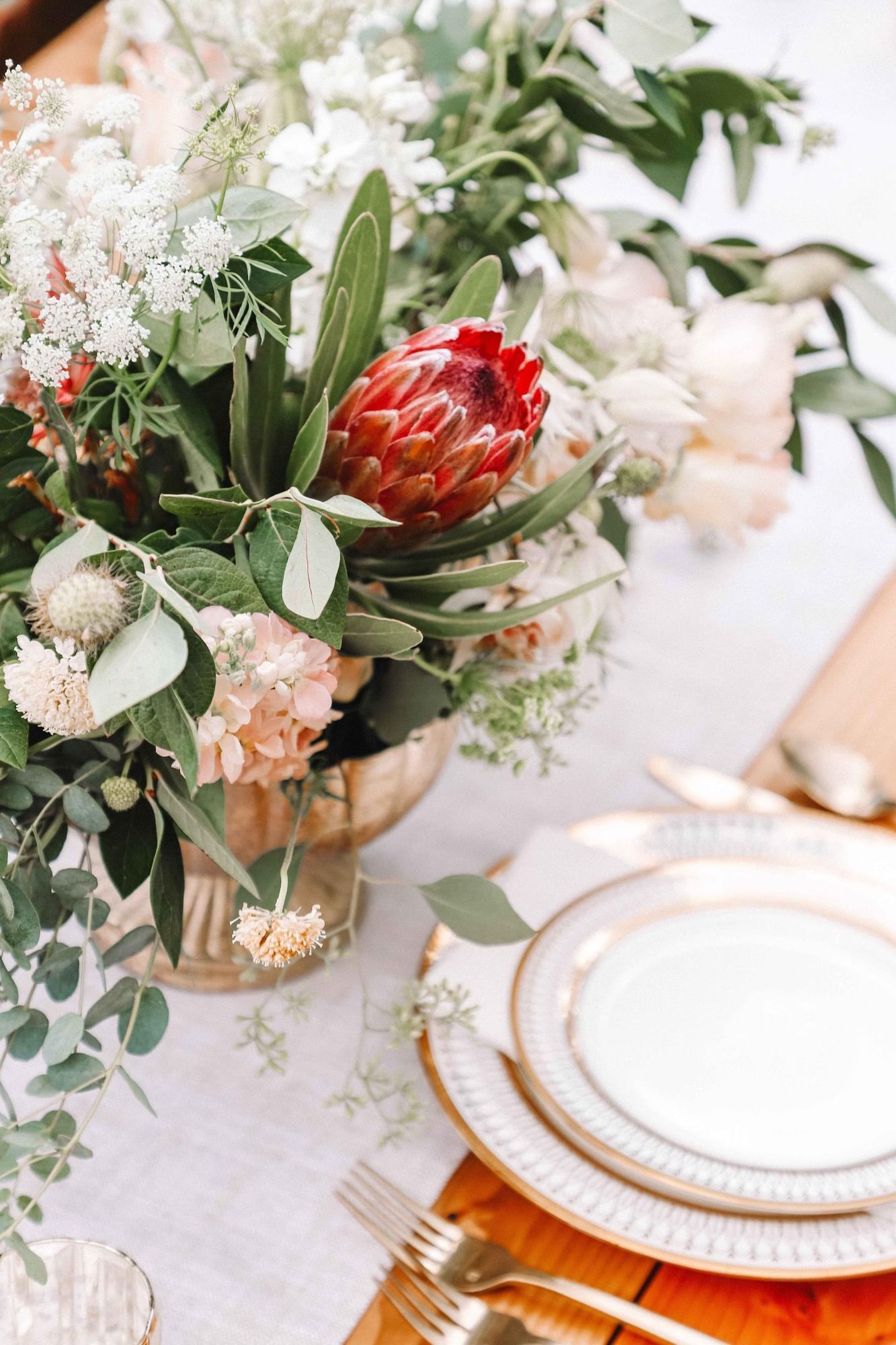 Fresh flower decorations on a dining table at The Artisan Hotel at Tuscan Village