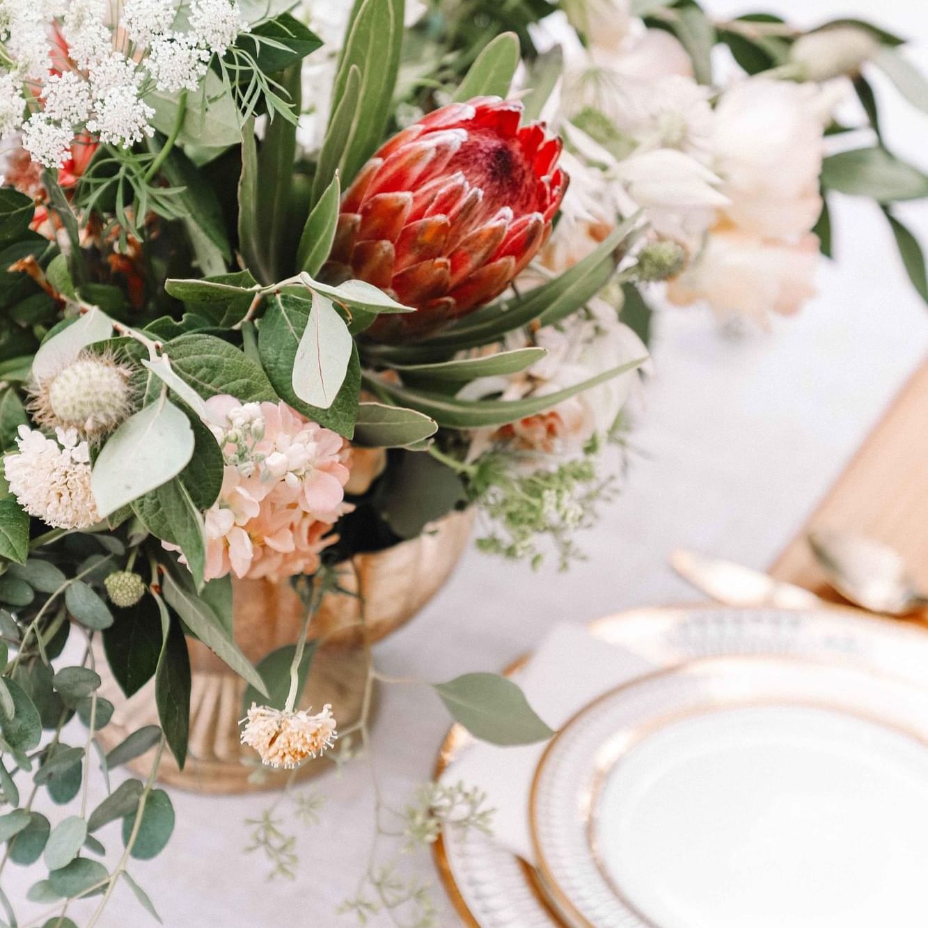 Fresh flower decorations on a dining table at The Artisan Hotel at Tuscan Village
