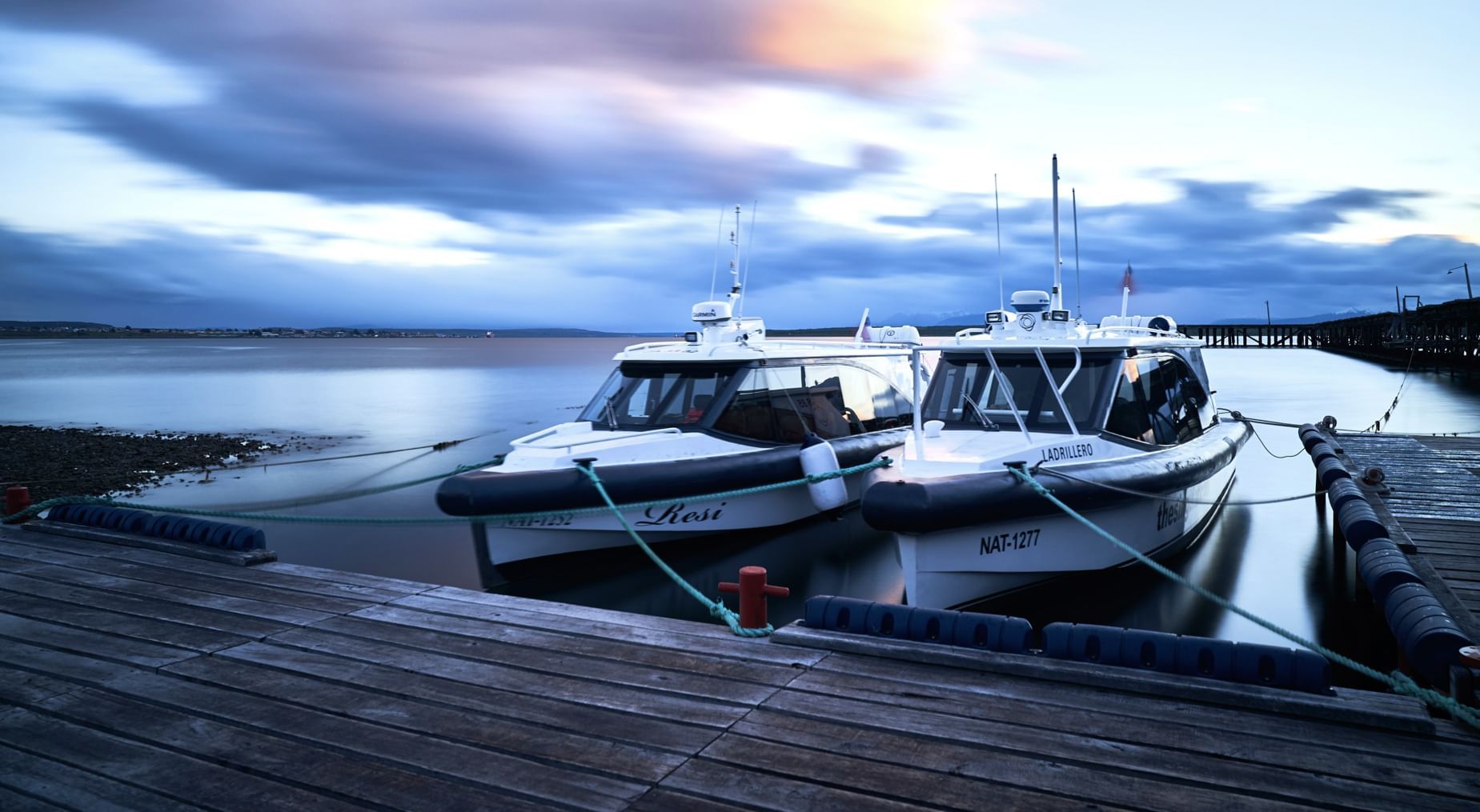 Two yachts at a pier near The Singular Patagonia