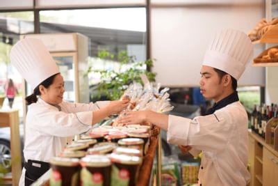 Chef arranging foods in restaurant at Hanoi Daewoo Hotel