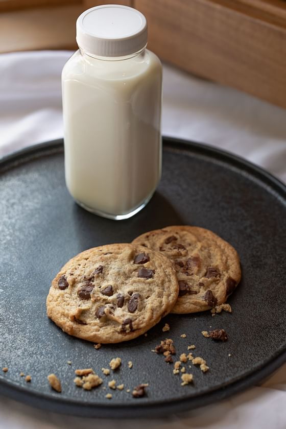 two cookies and a jar of milk