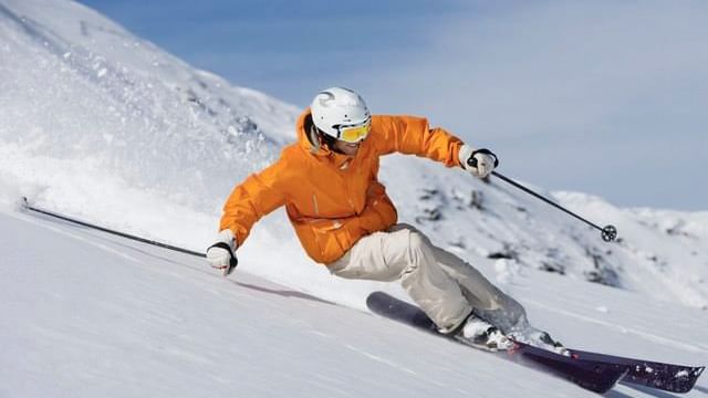 Close-up of a man skiing on a snow path near Chateaux Deer Valley