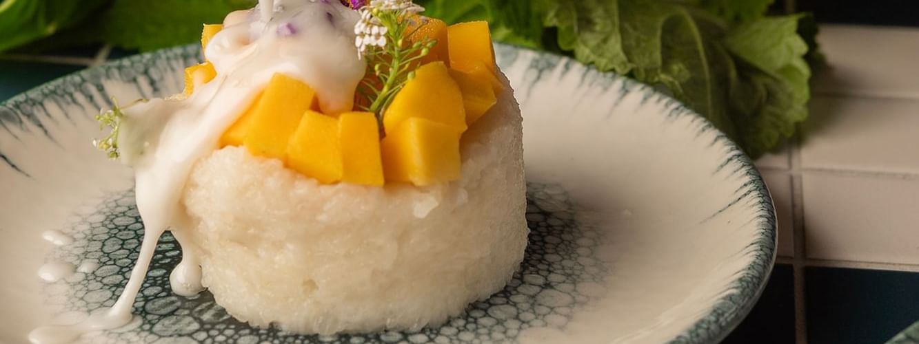 Mango sticky rice dessert with coconut milk served at Boulevard Brasserie & Bar in Novotel Sydney Olympic Park