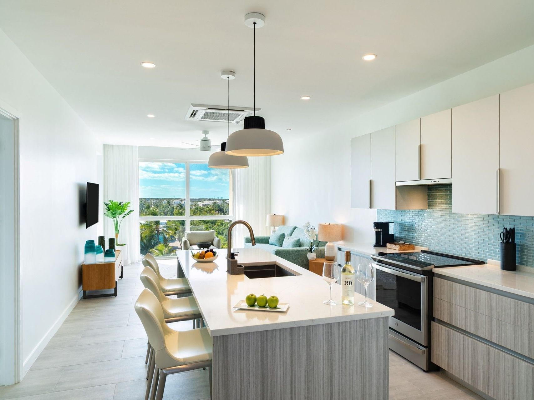 Kitchen and dining area in Jr. Suite One Bedroom with Grace Bay street view at Ellipse Resort, Grace Bay.