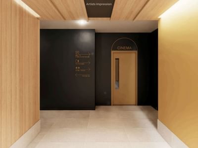 Modern hallway with wooden walls and black cinema door at UniLodge Brisbane City.