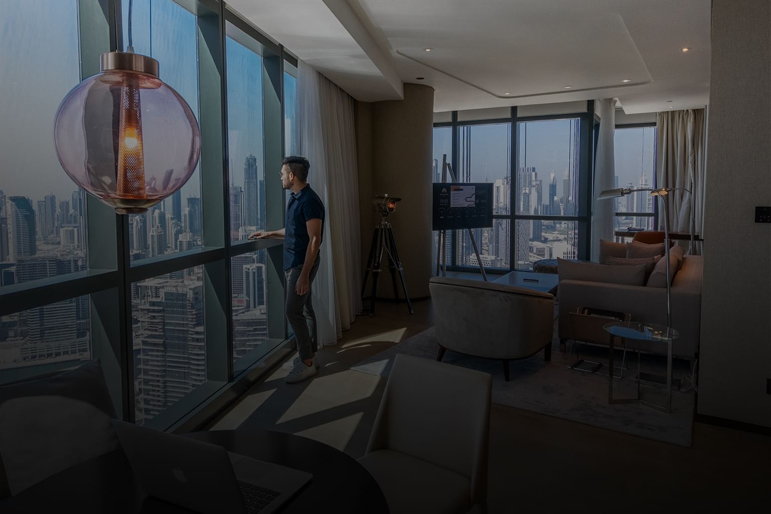 Man enjoying the city view from Premiere Suite at Paramount Hotel Dubai