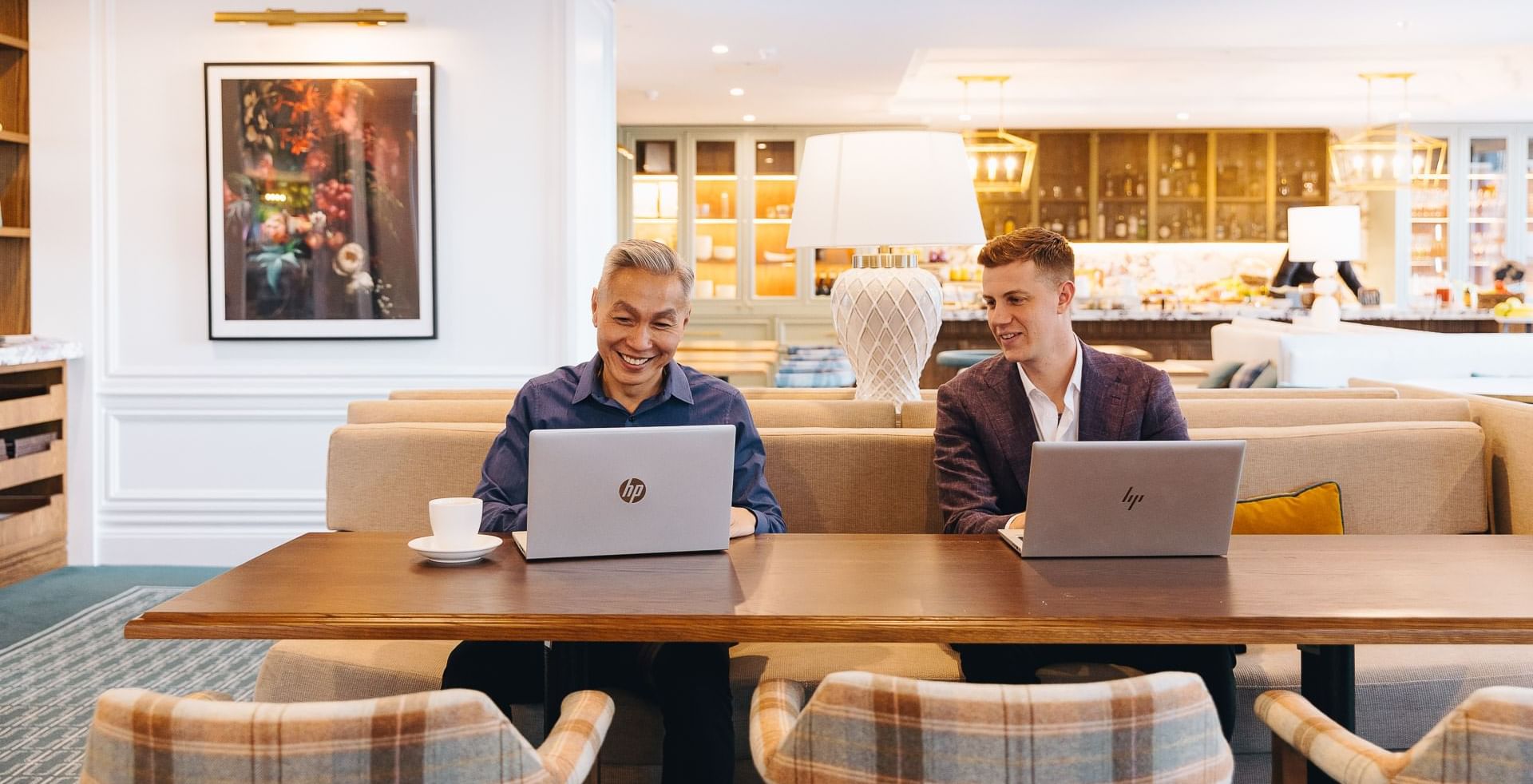 Men working on laptops at Pullman Melbourne City Centre
